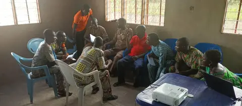 Board members in a practical session during their training course